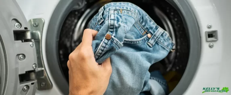 KDC - A person putting jeans into the washing machine